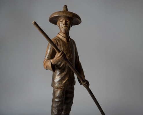 Bronze sculpture of a Chinese Fisherman rowing his boat