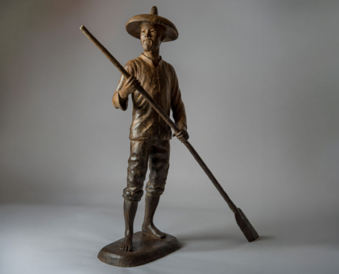 Bronze sculpture of a Chinese Fisherman rowing his boat