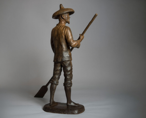 Bronze sculpture of a Chinese Fisherman rowing his boat