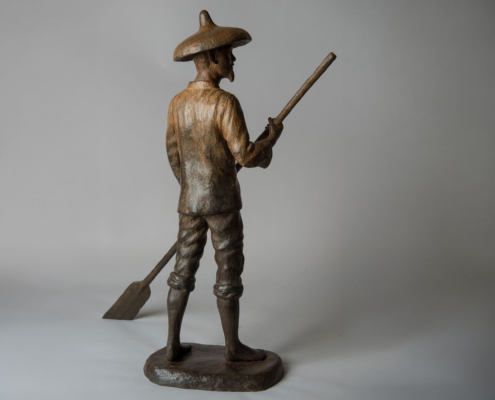 Bronze sculpture of a Chinese Fisherman rowing his boat