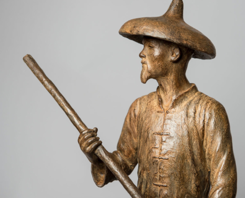 Bronze sculpture of a Chinese Fisherman rowing his boat