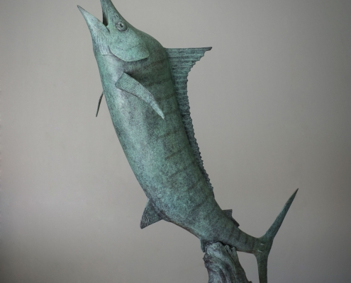 Bronze sculpture of a leaping marlin fish