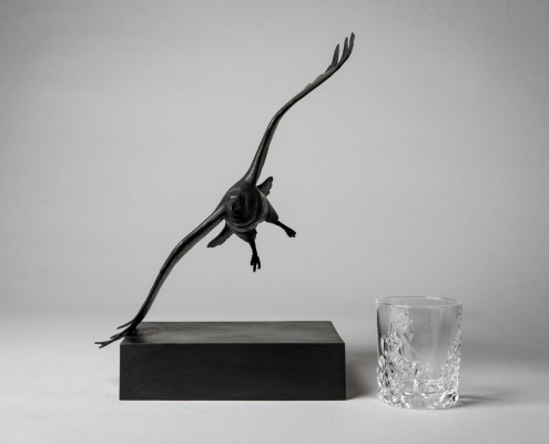 Bronze sculpture of a flying Raven by wildlife artist Anthony Smith