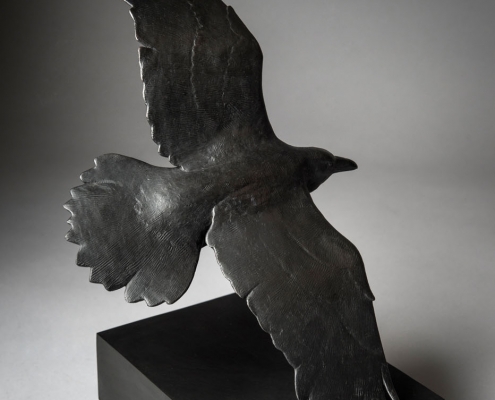 Bronze sculpture of a flying Raven by wildlife artist Anthony Smith