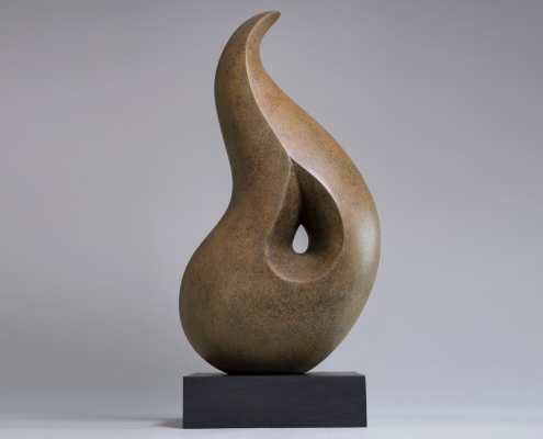 Smooth bronze abstract sculpture with flowing curves