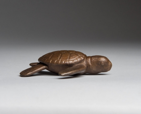 Bronze sculpture of a turtle hatchling by wildlife artist Anthony Smith