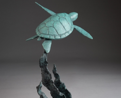 Bronze sculpture of a swimming Green turtle by artist Anthony Smith